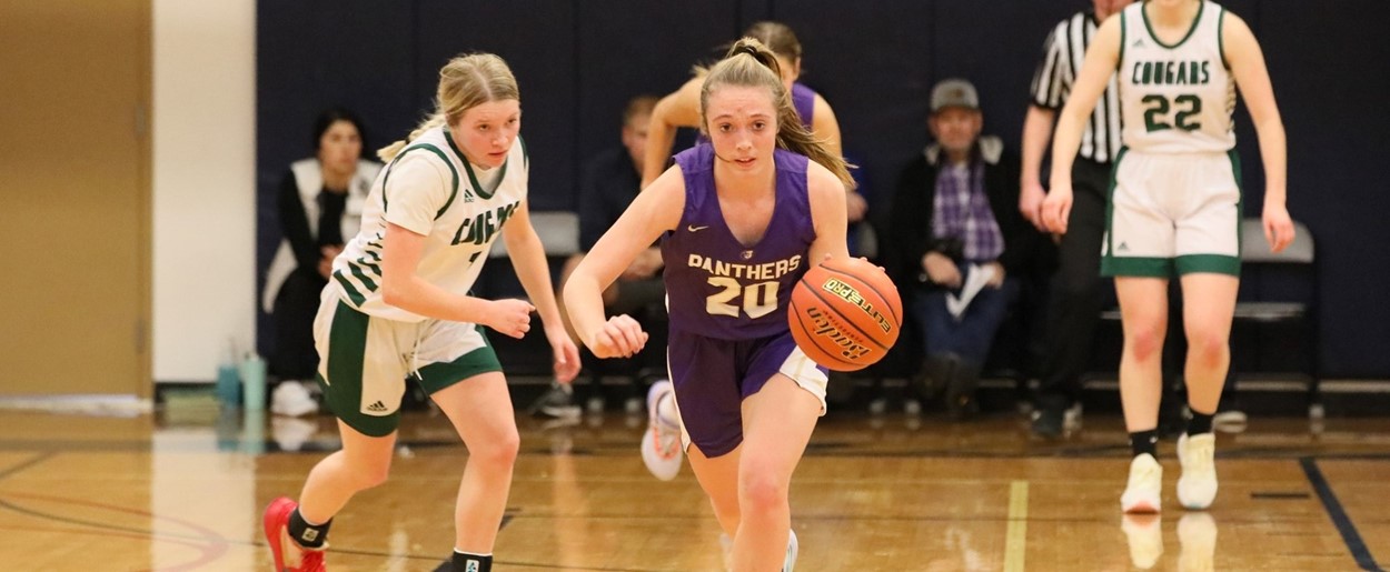 JHS girls basketball player takes the ball down the court